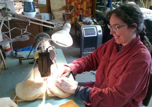 Shelagh sewing slipper tops.