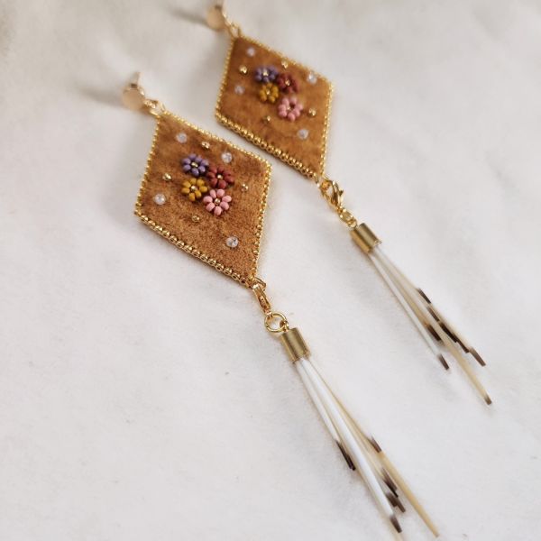 beaded flowers on moosehide earrings with porcupine quill dangles